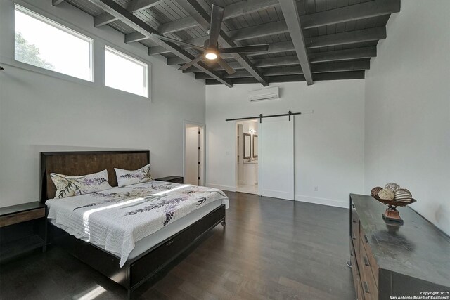 5738 Brenda Ln, San Antonio, TX 78240 - bedroom with a barn door, a wooden ceiling with exposed beams, a wall unit AC, dark wood finished floors, and a towering ceiling
