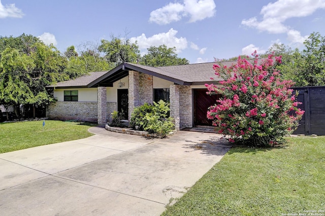 5738 Brenda Ln, San Antonio, TX 78240 - view of front of property featuring stone siding, a front yard, a garage, stucco siding, and driveway