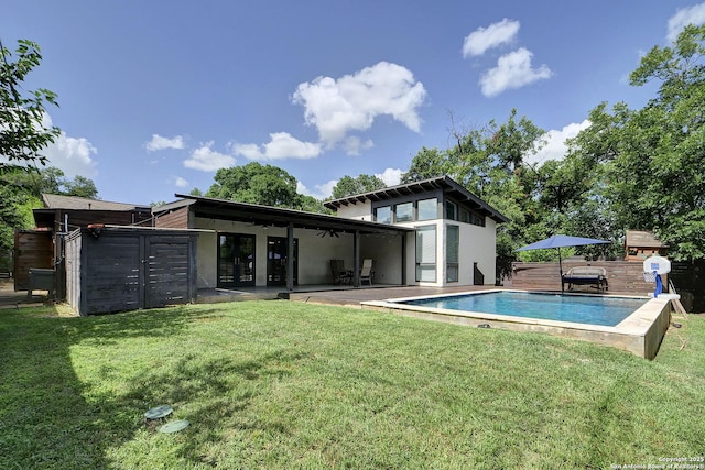 5738 Brenda Ln, San Antonio, TX 78240 - rear view of house with a lawn, a patio, ceiling fan, and an outdoor pool