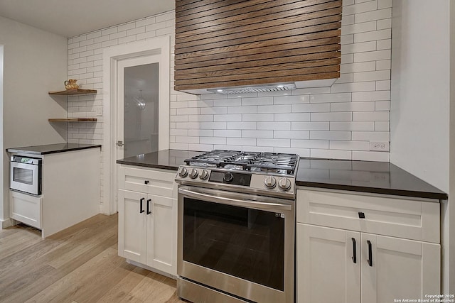 5738 Brenda Ln, San Antonio, TX 78240 - kitchen featuring stainless steel gas stove, dark countertops, open shelves, and range hood