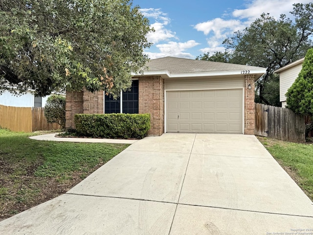 1222 Bobcat Pass, San Antonio, TX 78251 - view of front of house with concrete driveway, an attached garage, and brick siding