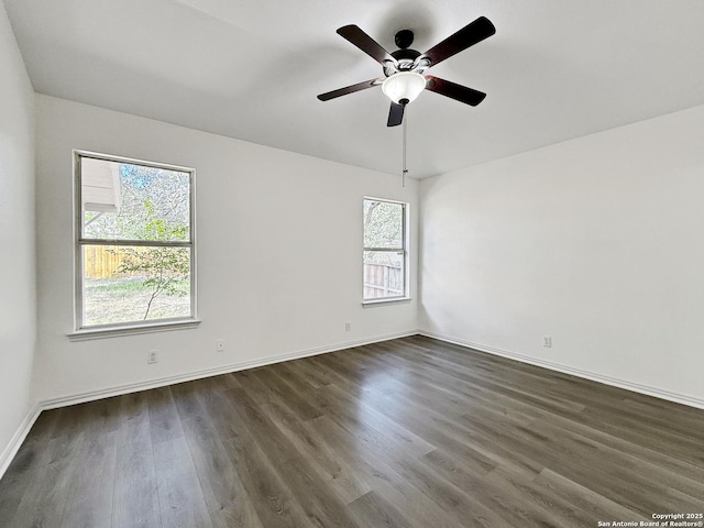 1222 Bobcat Pass, San Antonio, TX 78251 - unfurnished room with healthy amount of natural light, dark wood-style flooring, and a ceiling fan