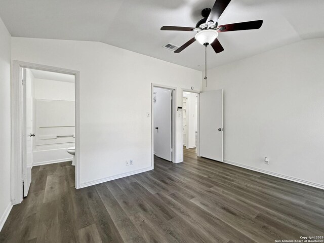 1222 Bobcat Pass, San Antonio, TX 78251 - unfurnished bedroom with vaulted ceiling, dark wood-type flooring, ensuite bath, and ceiling fan