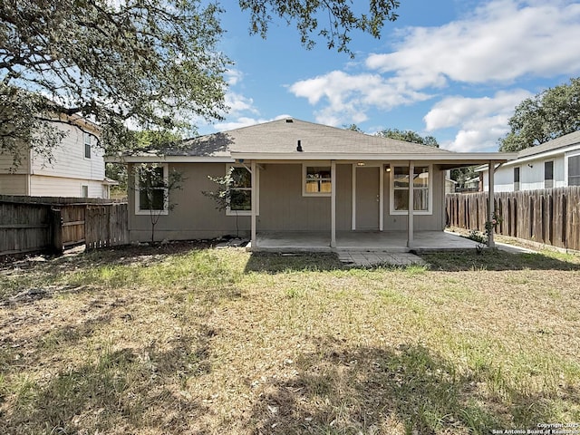 1222 Bobcat Pass, San Antonio, TX 78251 - back of house with a fenced backyard and a patio