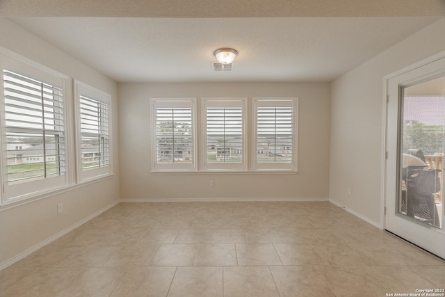 13119 Sulphur Trl, San Antonio, TX 78253 - unfurnished room with healthy amount of natural light and light tile patterned floors