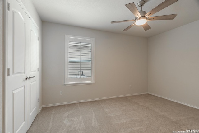 13119 Sulphur Trl, San Antonio, TX 78253 - unfurnished bedroom with light carpet, ceiling fan, and a closet