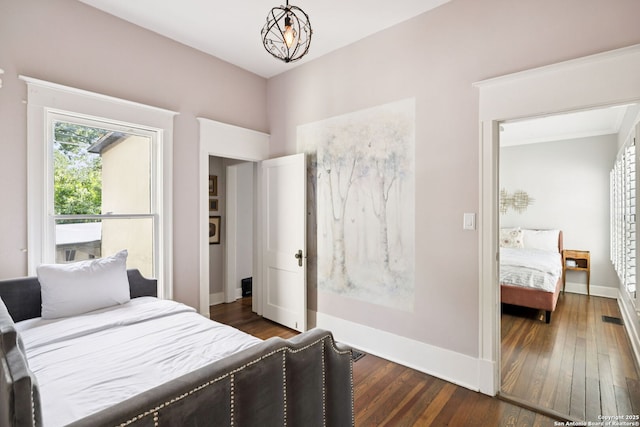 133 E Mistletoe Ave, San Antonio, TX 78212 - bedroom with dark wood-style flooring