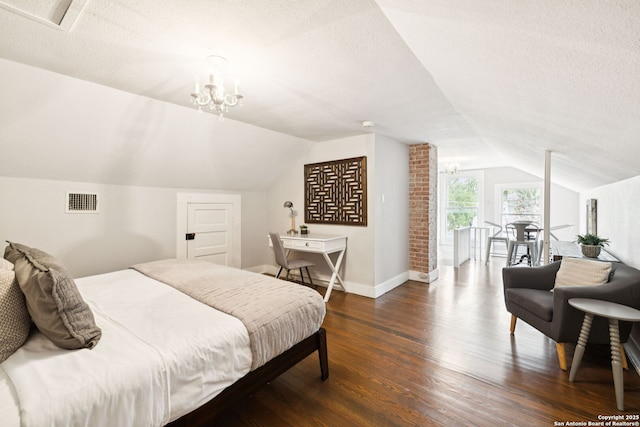 133 E Mistletoe Ave, San Antonio, TX 78212 - bedroom featuring lofted ceiling, wood finished floors, a textured ceiling, and a chandelier