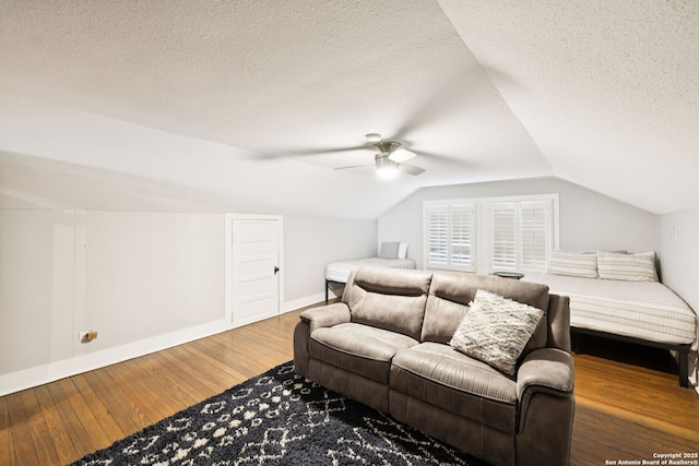 133 E Mistletoe Ave, San Antonio, TX 78212 - bedroom featuring wood-type flooring, vaulted ceiling, a textured ceiling, and a ceiling fan