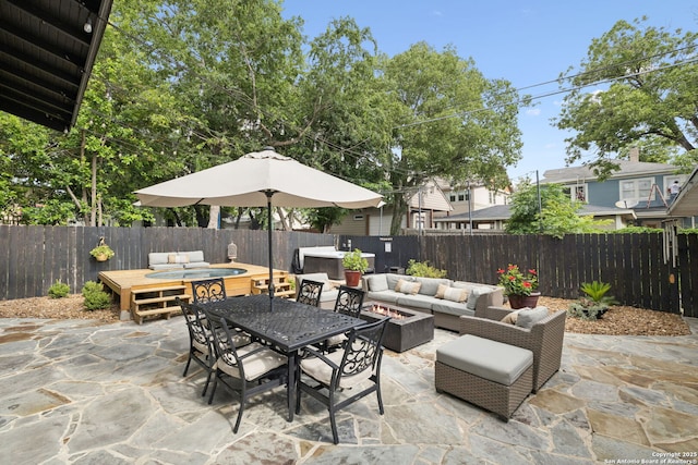 133 E Mistletoe Ave, San Antonio, TX 78212 - fenced backyard with an outdoor living space with a fire pit, outdoor dining space, a patio, and a hot tub
