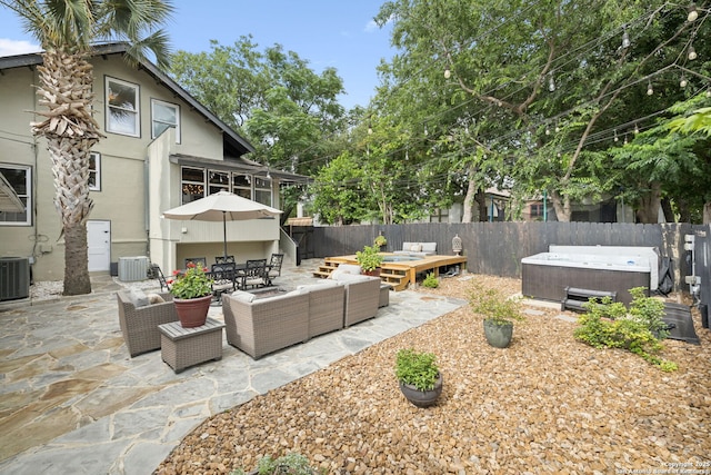 133 E Mistletoe Ave, San Antonio, TX 78212 - fenced backyard featuring a hot tub, an outdoor living space, a patio area, and outdoor dining space