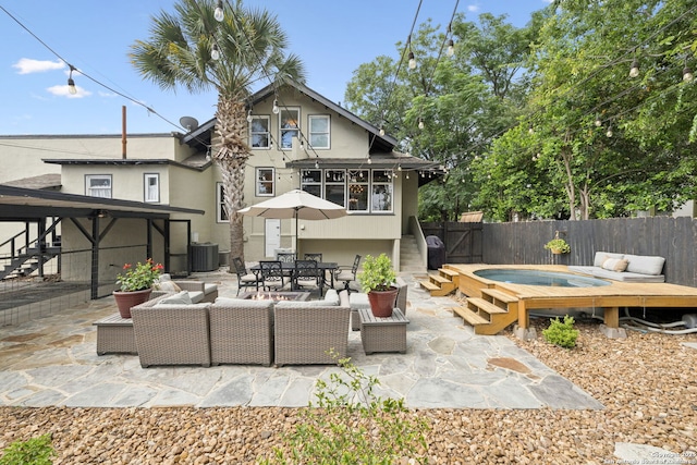 133 E Mistletoe Ave, San Antonio, TX 78212 - rear view of property featuring an outdoor living space, stairway, a patio, and stucco siding