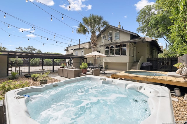 133 E Mistletoe Ave, San Antonio, TX 78212 - back of property with a hot tub and outdoor lounge area