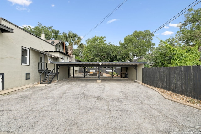 133 E Mistletoe Ave, San Antonio, TX 78212 - exterior space featuring driveway and a carport