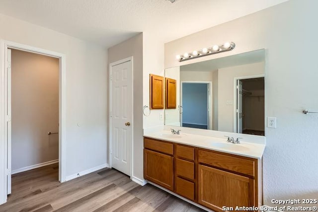 2727 Encino Riv, San Antonio, TX 78259 - bathroom with double vanity and wood finished floors