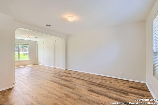 2727 Encino Riv, San Antonio, TX 78259 - unfurnished room featuring arched walkways and wood finished floors