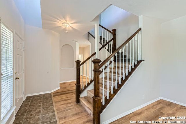 2727 Encino Riv, San Antonio, TX 78259 - entrance foyer featuring wood finished floors, stairway, and arched walkways