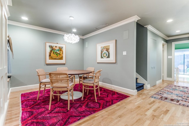 117 Saint Dennis Unit 117, San Antonio, TX 78209 - dining room featuring ornamental molding, stairs, wood finished floors, a chandelier, and recessed lighting