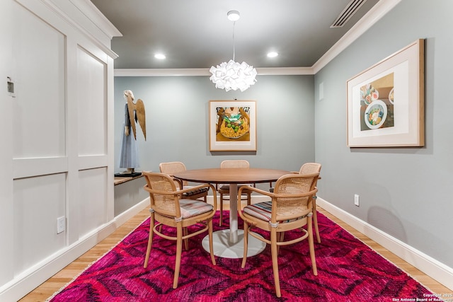 117 Saint Dennis Unit 117, San Antonio, TX 78209 - dining area featuring light wood-style floors, crown molding, and recessed lighting