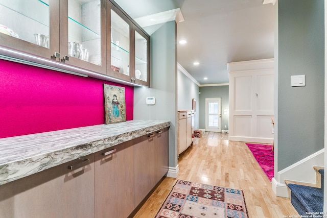 117 Saint Dennis Unit 117, San Antonio, TX 78209 - corridor featuring ornamental molding, light wood-style floors, and stairway
