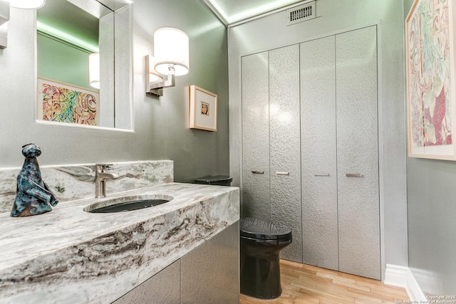 117 Saint Dennis Unit 117, San Antonio, TX 78209 - bathroom featuring wood finished floors and vanity
