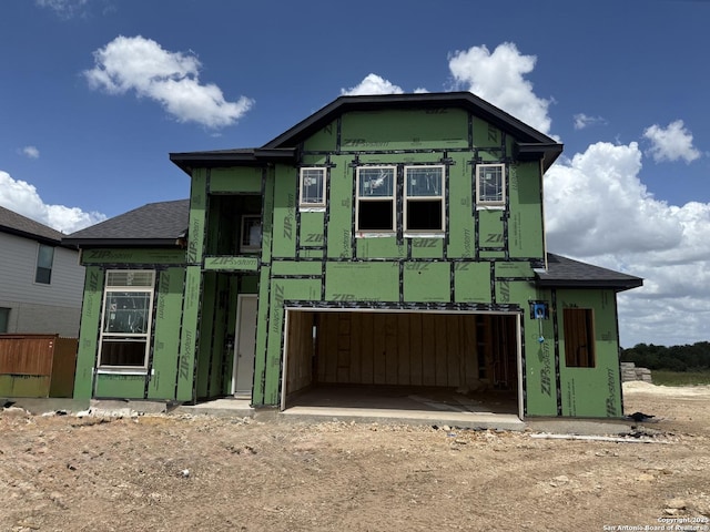 9354 Luke Path, San Antonio, TX 78254 - property under construction featuring an attached garage, a shingled roof, dirt driveway, and stucco siding