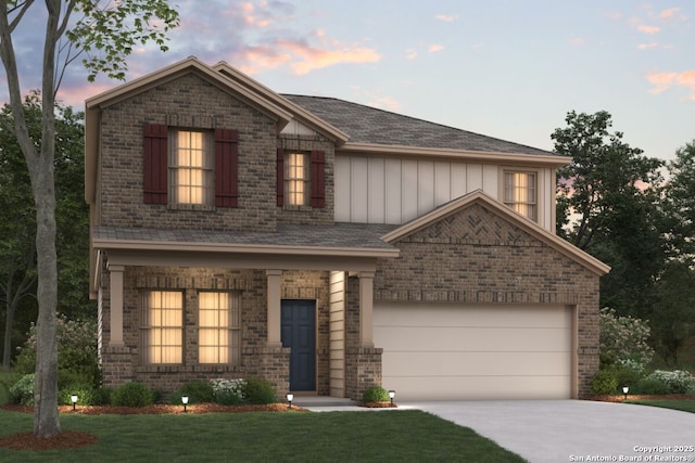 2210 Croaker Crk, San Antonio, TX 78245 - view of front facade featuring board and batten siding, concrete driveway, brick siding, an attached garage, and a yard