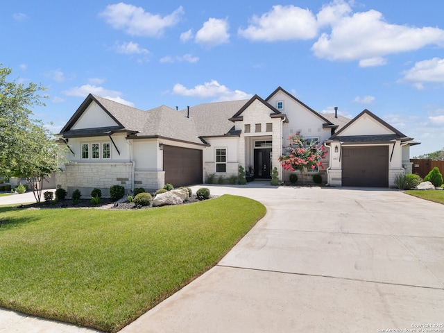 25022 Dulzura, San Antonio, TX 78261 - french provincial home with stone siding, a garage, concrete driveway, and a front lawn