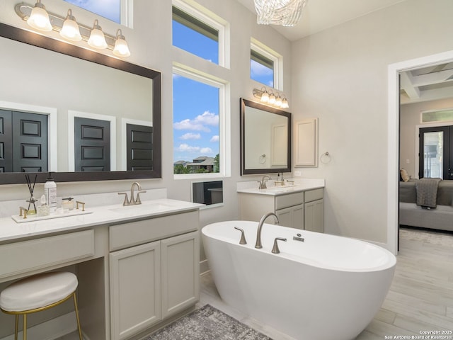 25022 Dulzura, San Antonio, TX 78261 - bathroom featuring a soaking tub, vanity, ensuite bathroom, and beam ceiling
