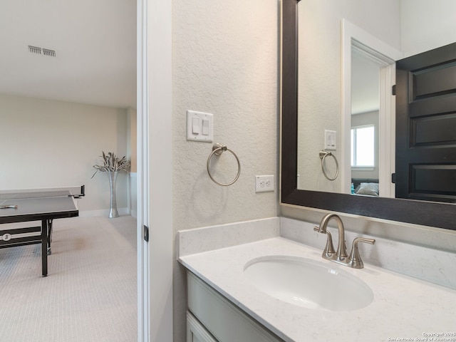 25022 Dulzura, San Antonio, TX 78261 - bathroom with vanity and a textured wall