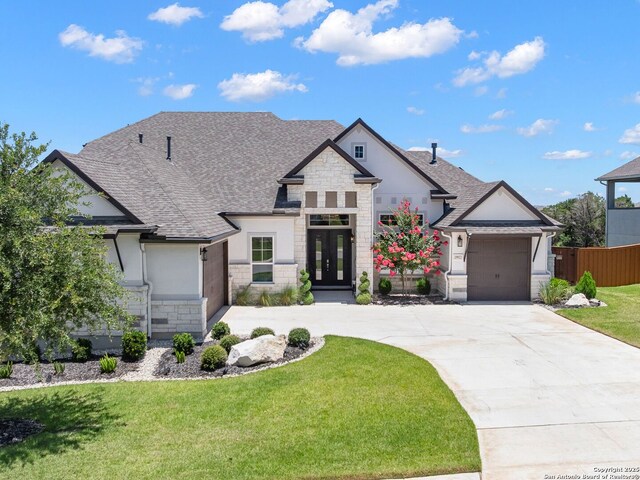 25022 Dulzura, San Antonio, TX 78261 - french country inspired facade with stone siding, roof with shingles, driveway, a garage, and french doors