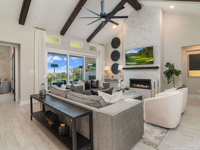 25022 Dulzura, San Antonio, TX 78261 - living room featuring high vaulted ceiling, beam ceiling, ceiling fan, a high end fireplace, and recessed lighting
