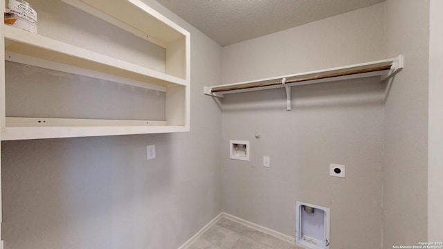 2076 Meadow Pipit, New Braunfels, TX 78130 - washroom with hookup for an electric dryer, gas dryer hookup, washer hookup, and a textured ceiling