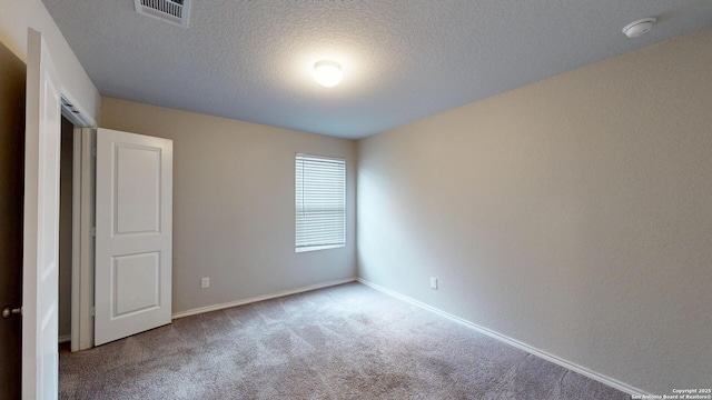 2076 Meadow Pipit, New Braunfels, TX 78130 - unfurnished bedroom featuring carpet and a textured ceiling