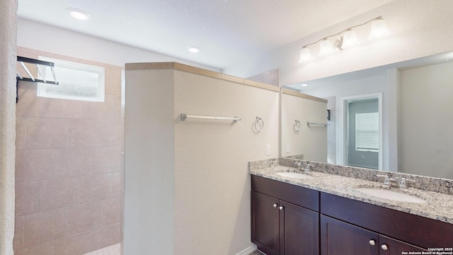 2076 Meadow Pipit, New Braunfels, TX 78130 - bathroom featuring double vanity, walk in shower, and recessed lighting