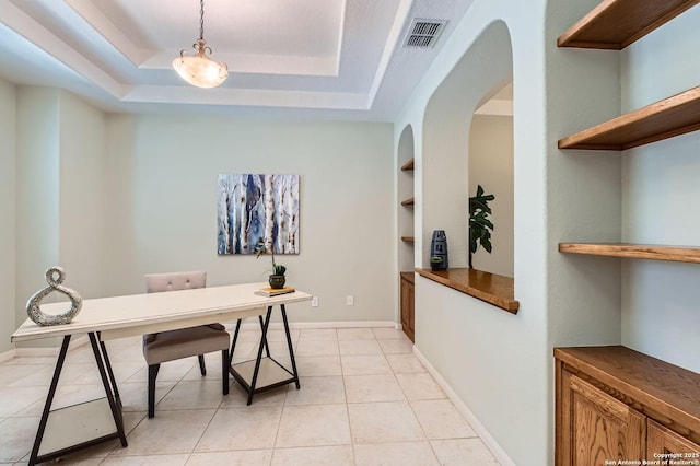 34 Roseheart, San Antonio, TX 78259 - office area with arched walkways, a raised ceiling, built in shelves, and light tile patterned floors
