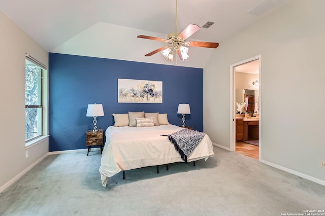 34 Roseheart, San Antonio, TX 78259 - bedroom with carpet floors, lofted ceiling, multiple windows, ensuite bathroom, and ceiling fan