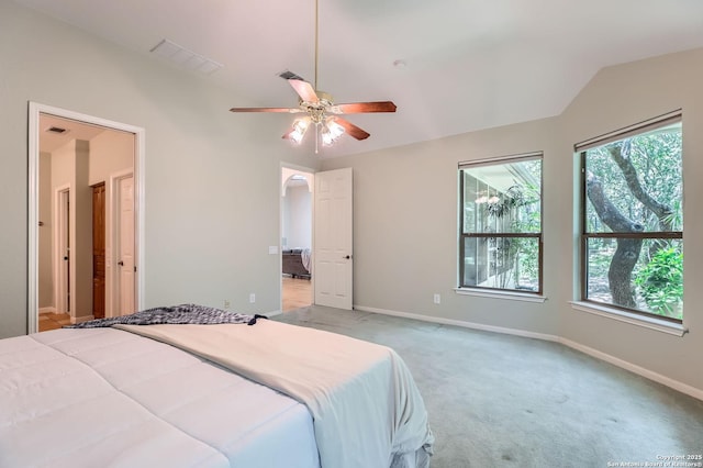 34 Roseheart, San Antonio, TX 78259 - bedroom featuring lofted ceiling, multiple windows, light colored carpet, and a ceiling fan