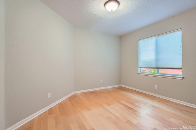 34 Roseheart, San Antonio, TX 78259 - empty room featuring light wood-style floors and a textured ceiling