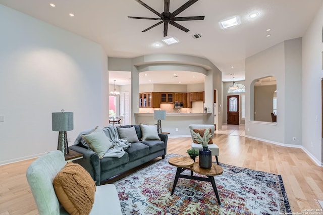 34 Roseheart, San Antonio, TX 78259 - living room with arched walkways, ceiling fan, light wood-type flooring, recessed lighting, and a chandelier