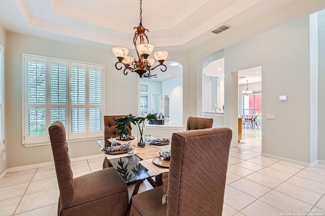 34 Roseheart, San Antonio, TX 78259 - dining space with a chandelier, healthy amount of natural light, a raised ceiling, and light tile patterned flooring