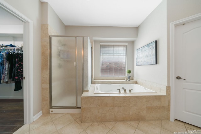 3118 Limestone, San Antonio, TX 78253 - bathroom with a bath, a shower stall, tile patterned floors, and a spacious closet