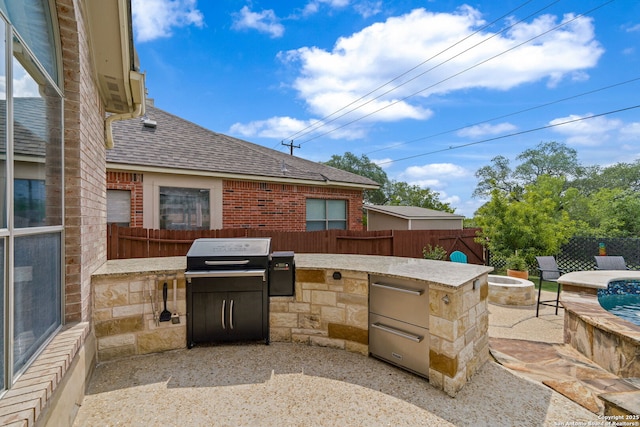 3118 Limestone, San Antonio, TX 78253 - fenced backyard with exterior kitchen, a patio, and a fire pit