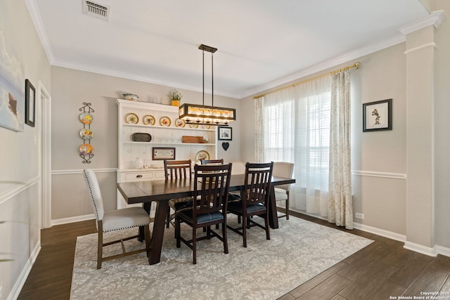3118 Limestone, San Antonio, TX 78253 - dining room featuring dark wood finished floors, ornamental molding, and decorative columns