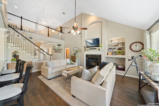 3118 Limestone, San Antonio, TX 78253 - living area with wood finished floors, ceiling fan, stairs, a tiled fireplace, and built in features