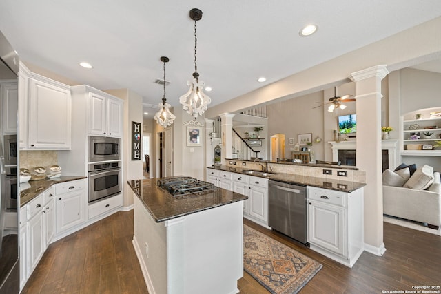 3118 Limestone, San Antonio, TX 78253 - kitchen featuring appliances with stainless steel finishes, ornate columns, a ceiling fan, open floor plan, and recessed lighting