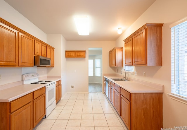 16914 Redhorse Pass, San Antonio, TX 78247 - kitchen featuring appliances with stainless steel finishes, brown cabinetry, and light countertops