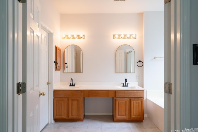 16914 Redhorse Pass, San Antonio, TX 78247 - bathroom with double vanity, tile patterned floors, and a bath