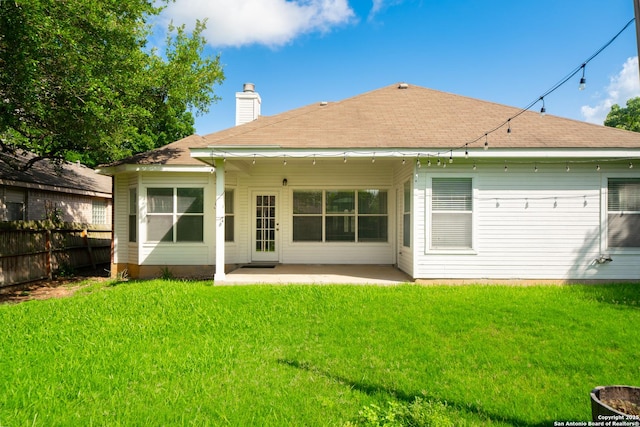 16914 Redhorse Pass, San Antonio, TX 78247 - rear view of house featuring a patio area, a chimney, and roof with shingles