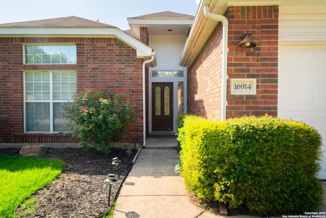 16914 Redhorse Pass, San Antonio, TX 78247 - doorway to property featuring brick siding and a garage